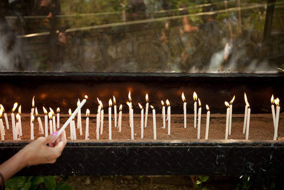 Pilgrims Lighting Candles at Virgin Mary’s Home