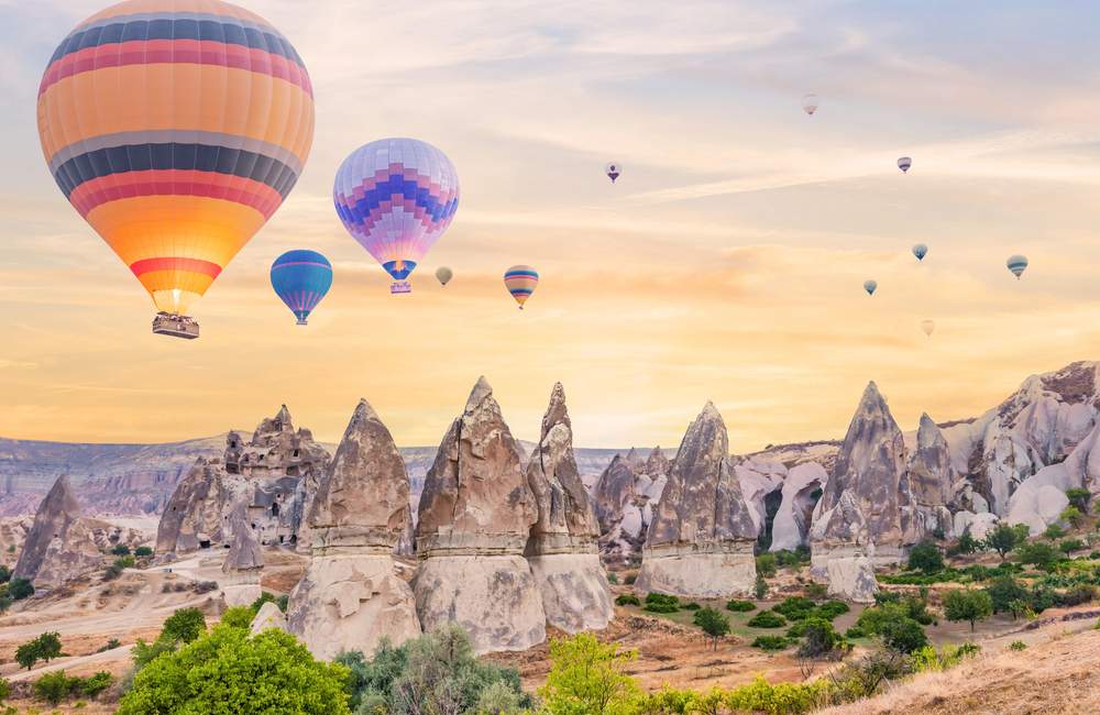 Hot Air Balloons Above Cappadocia Rocks